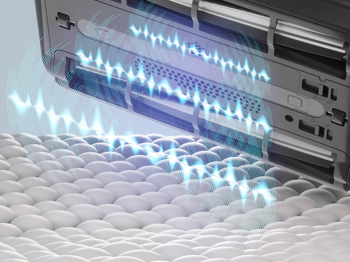 Ultrasonic waves emitted from the cleaning device, demonstrating its ability to penetrate surfaces for effective cleaning and allergen removal.