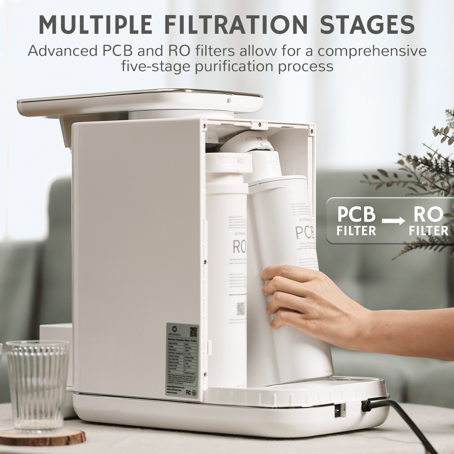 Countertop water dispenser with touch controls, dispensing water into a clear cup.