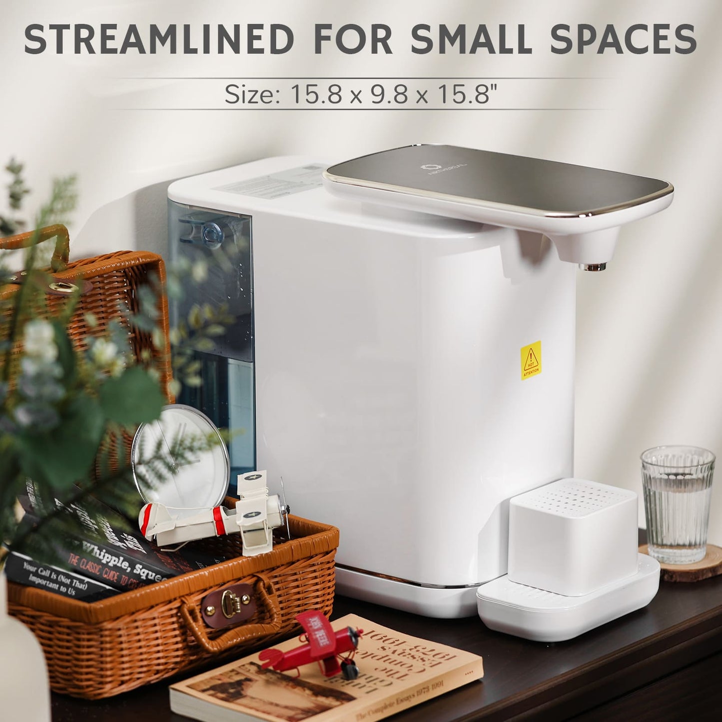 Countertop water dispenser with touch controls, dispensing water into a clear cup.