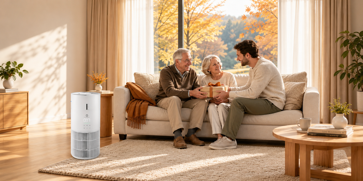 A family sitting in a cozy living room during fall/winter with an Airthereal air purifier running on the floor.