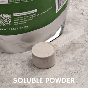 A scoop of soluble powder sits next to a green packaging bag, highlighting its easy-to-use format for various applications.