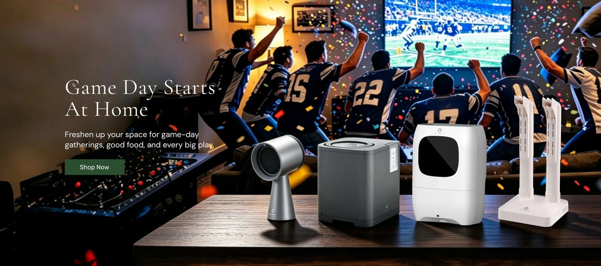 A promotional scene showing several home appliance products on a table in a living room, with people in the background watching a football game.