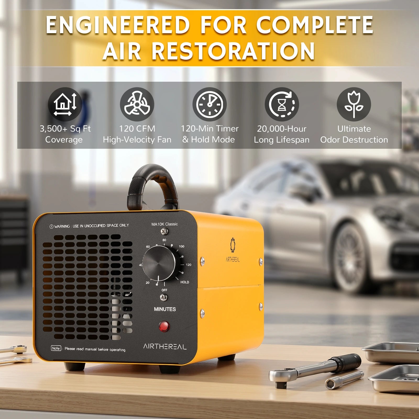 A yellow and black Airthereal MA10K Classic Ozone Generator sits on a wooden table in a garage setting, with a blurred silver car in the background and an informational banner at the top.